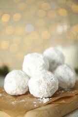 Fototapeta na wymiar Tasty Christmas snowball cookies on table, closeup