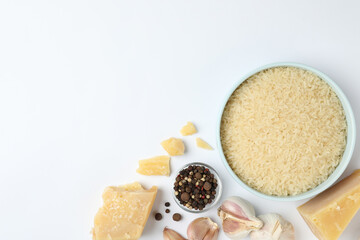Different ingredients on white background, top view. Risotto recipe
