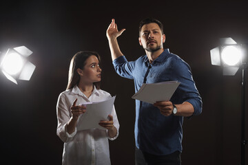 Professional actors rehearsing on stage in theatre