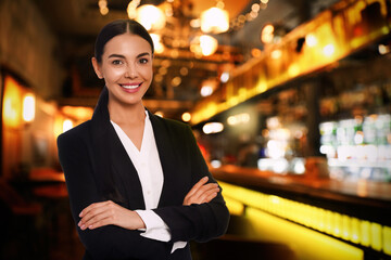 Portrait of hostess wearing uniform in bar. Space for text - obrazy, fototapety, plakaty