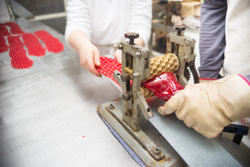 Confectioners making candy in traditional candy workshop - 530458625