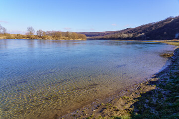 Beautiful view of the river bank calm winter wildlife. Background with copy space