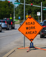 Road Work Ahead Warning Sign With Traffic