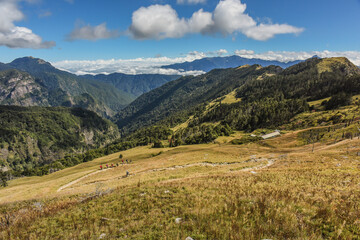 Obraz premium Panoramic View Of The Holy Ridge And Glacial Cirque At Sunrise On The Trail To Main Peak Of Xue Mountain (Snow mountain) , Shei-Pa National Park, Taiwan
