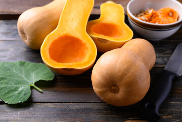Butternut squash or butternut pumpkin on wooden background prepare for cooking