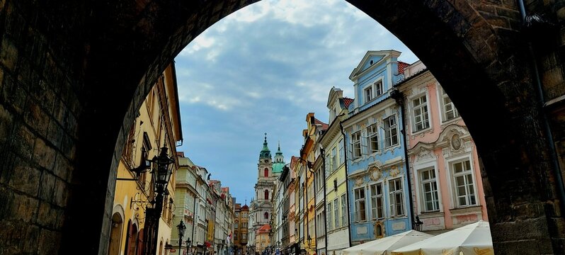 View From Under An Arch, Of A Beautiful, Colorful Street in Prague