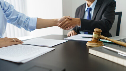 Lawyer and justice concept, Businessman and senior lawyer shaking hands after successful agreement