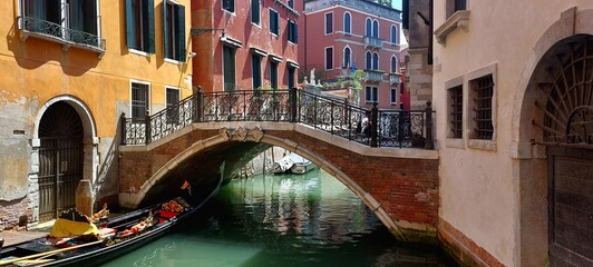 Bridge in Venice with Colorful Buildings and Blue Water