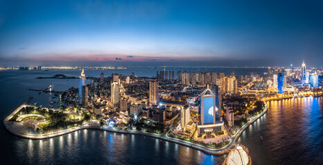 Aerial photography night view of modern city buildings in Qingdao, China