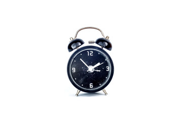 a black clock is on top of a pile of books with white background
