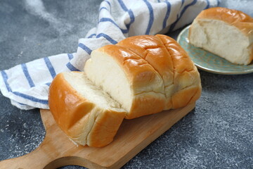 Fresh-baked homemade Hokkaido milk bread-Japanese soft and fluffy bread. - obrazy, fototapety, plakaty