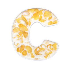 cornflakes cereal with milk in alphabet plate