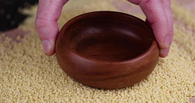 Put porridge couscous from wheat or millet, cooking dishes from traditional grits of crushed yellow couscous