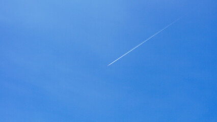 A passenger jet leaves a mark above the blue skies and the start of the airline after the kovic poisoning.