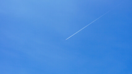 A passenger jet leaves a mark above the blue skies and the start of the airline after the kovic poisoning.