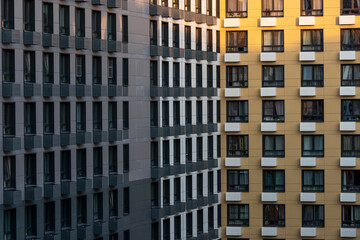 Geometric architectural background. Facade of corner apartment building. Aerial view.