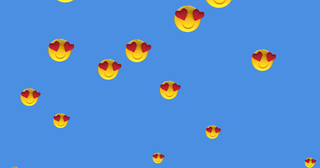 Multiple heart eyes face emoji moving against blue background