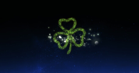 Image of green fireworks exploding with glowing green shamrock leaf on sky