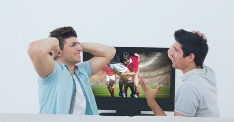Composition of two male sports fans watching rugby match on tv