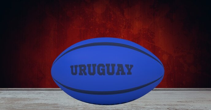 Composition of rugby ball decorated with text uruguay on black background