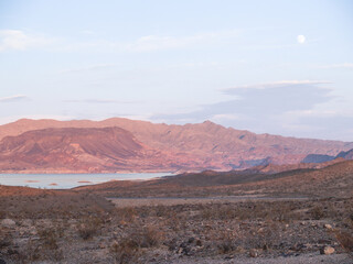 Lake mead, water reservoir surrounded by desert land and landforms.