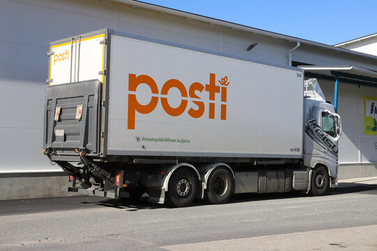 Ylitornio, Finland - August 29, 2022: The Finnish national postal service Posti parcel delivery truck outside the S Market super market.