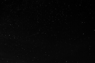 Astronomical long exposure photography of stars with a meteor or shooting star