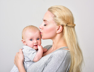 Mother and baby playing and smiling. Happy family.