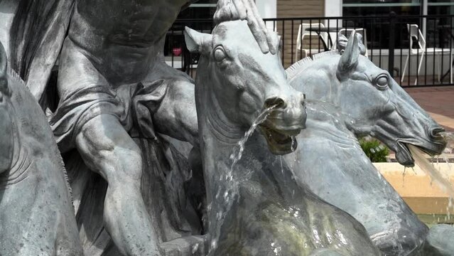 Slow motion shot of a water fountain featuring Poseidon and his horses.