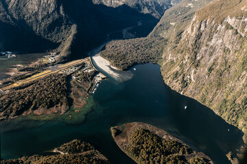 New Zealand. Milford Sound (Piopiotahi) from above - the head of the fiord with wharf and Milford Sound Airport.