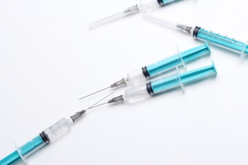 Medical syringe on a white background. A syringe for injection. The concept of health and beauty