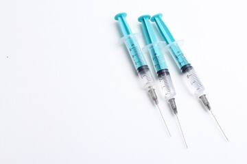 Medical syringe on a white background. A syringe for injection. The concept of health and beauty