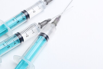 Medical syringe on a white background. A syringe for injection. The concept of health and beauty