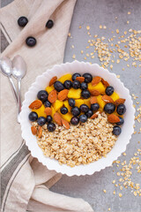 Bowl of oatmeal porridge with fresh fruits