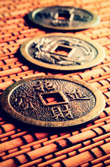 Fototapeta na wymiar three chinese coins for iching divination
