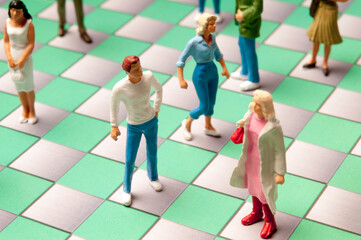 people miniature figurines on a checkerboard, social media concept