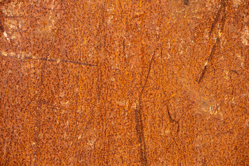 Old rusty metal surface. Abstract background for design purpose. Warm orange color. Random shapes.