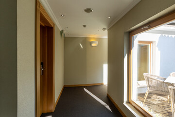 Interior of a hotel corridor with doors