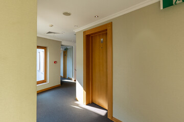 Interior of a hotel corridor with doors