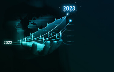 Businessman holding in hand increase arrow graph corporate future growth year 2022 to 2023....