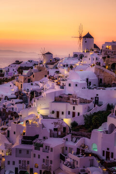 Sunset at the village of Oia Santorini Greece colorful sunset with whitewashed building at the old village of Oia Santorini Greece