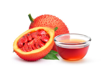 Gac fruit oil with fresh fruits isolated on white background.