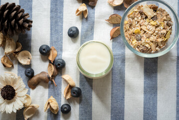 Fototapeta na wymiar yogurt with fresh blueberry on a wooden background. healthy cereal morning breakfast,oat