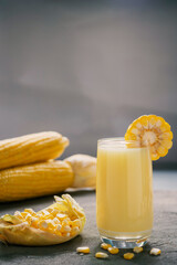 Yellow Sweet corn drink on wood  background , Yellow Corn juice, sweet corn milk, healthy organic food, bio nutrition