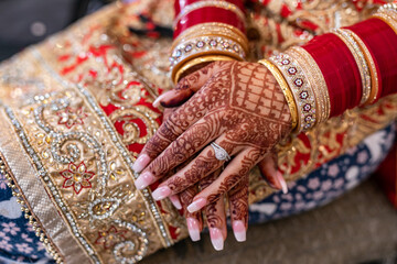 Indian Punjabi bride's hands with wedding henna mehendi mehndi close up