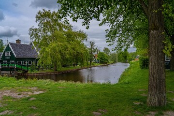 Rural landscape with windmill in Zaanse Schans. Holland, Netherlands. Authentic Zaandam mill. Beautiful Netherland landscape.