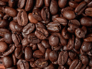 Coffee cup and coffee beans on a wooden background. View from above.