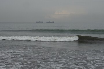 Morning view on Air Manis beach, West Sumatra with overcast sky. Air Manis Beach is closely related to the legend of Malin Kundang