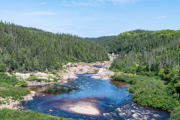 Beautiful view of a river flowing in the Côte-Nord region of Quebec, Canada