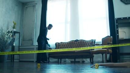 Detective Collecting Evidence in a Crime Scene. Forensic Specialists Making Expertise at Home of a Dead Person. Homicide Investigation by Professional Police Officer.
